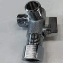 Metallic T-shaped valve on a light gray background