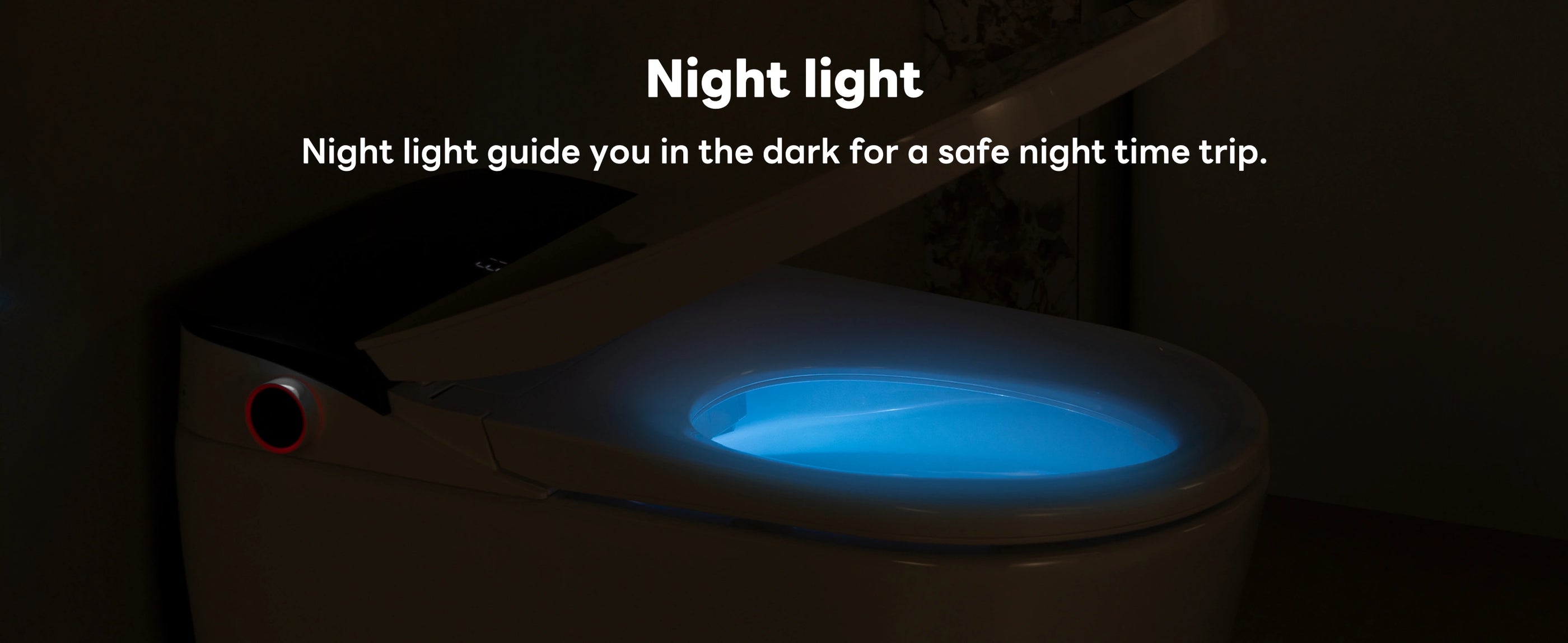 Toilet with night light feature glowing in the dark